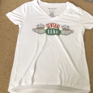 White Central part shirt from kohl’s with a small pink stain.